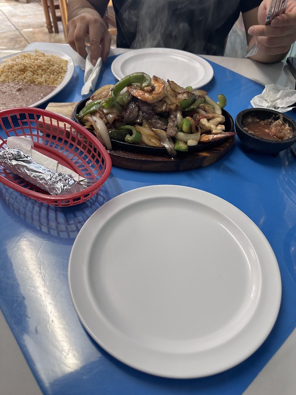 Assorted dishes shown beside a seafood menu.