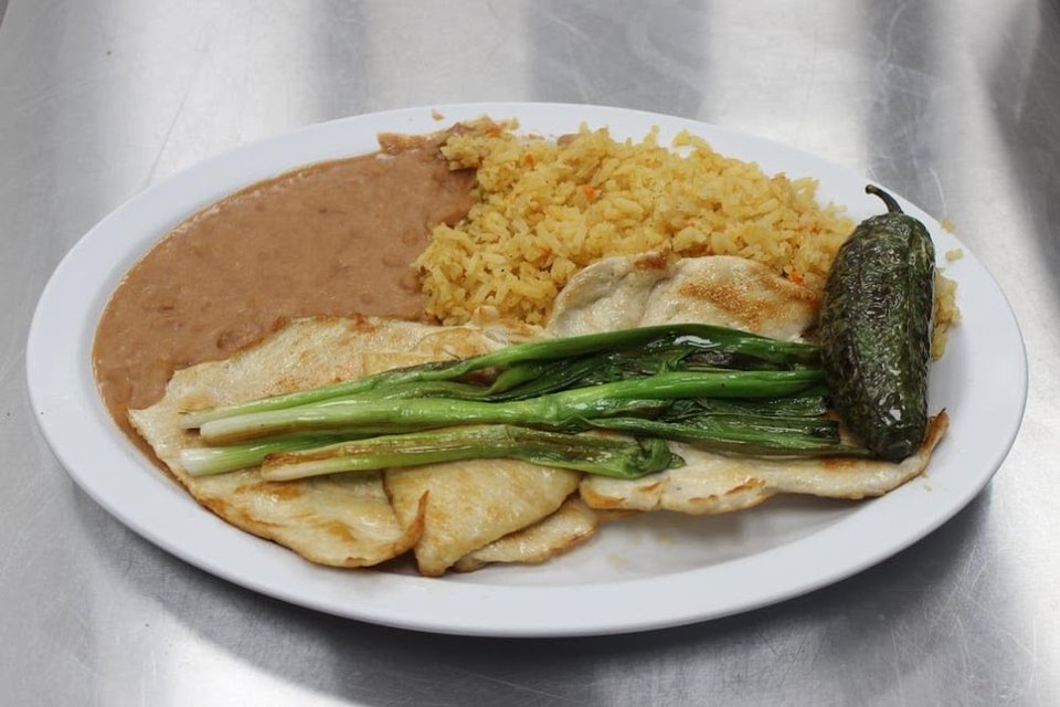 Restaurant menu highlighting shrimp, fish, and carne asada.