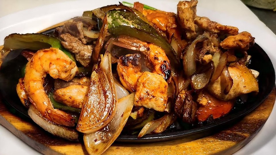 Menu pages listing mariscos and classic Mexican plates.